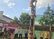 Meriahkan HUT Bhayangkara ke-79, Polsek Cikupa Gelar Lomba Panjat Pinang di Desa Talaga